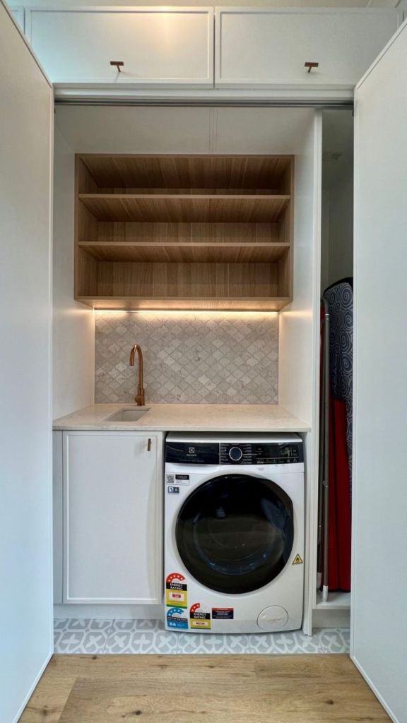 Custom Euro laundry installation in Perth with overhead storage