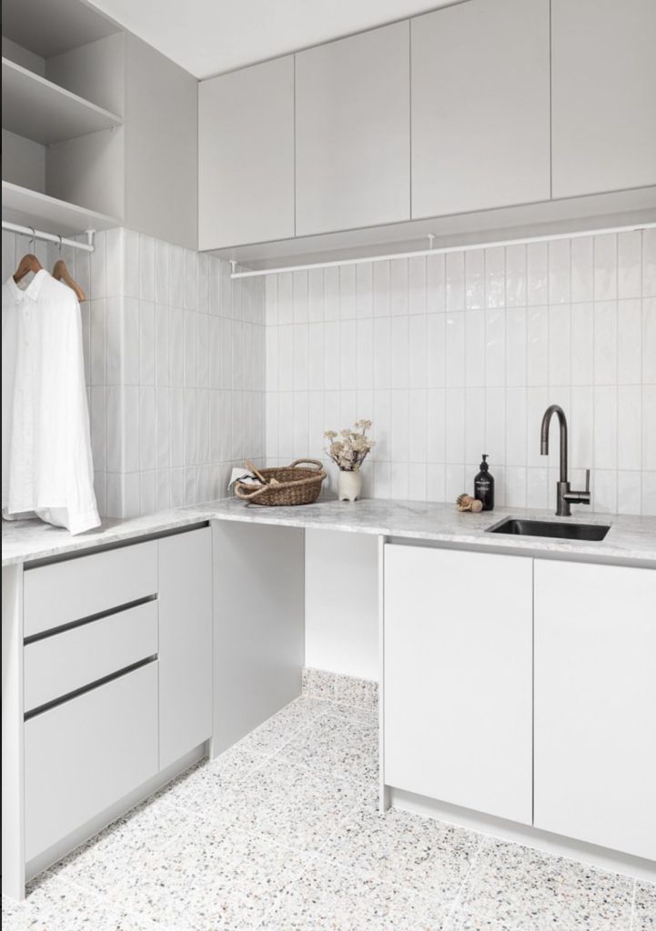 Modern small laundry renovation with space-saving storage Perth