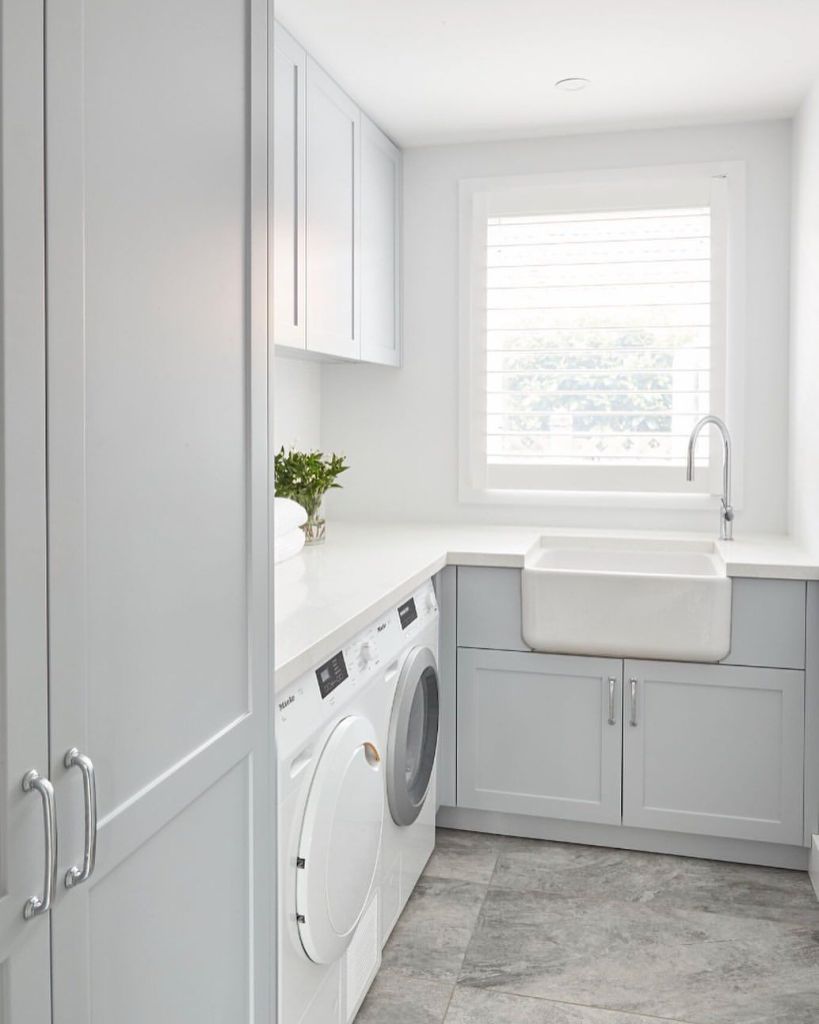 Small laundry renovation in Perth home with stacked washer and custom cabinetry